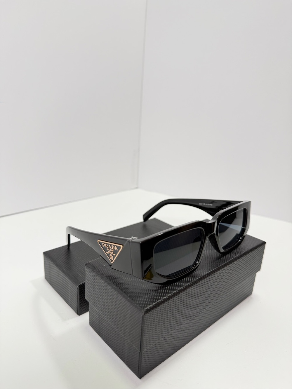 Prada Glossy Black Rectangular Sunglasses with Gold Logo